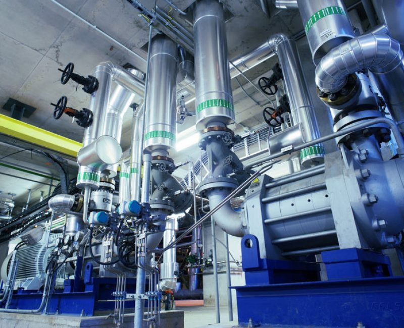 Equipment, cables and piping as found inside of a modern industrial power plant