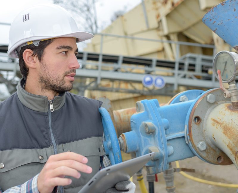 Industrial worker holding tablet