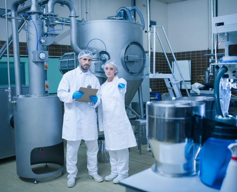 Food technicians working together in a food processing plant