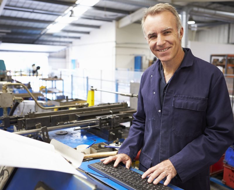 Factory Engineer Operating Hydraulic Tube Bender